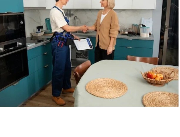 Kitchen fitter greeting a satisfied customer