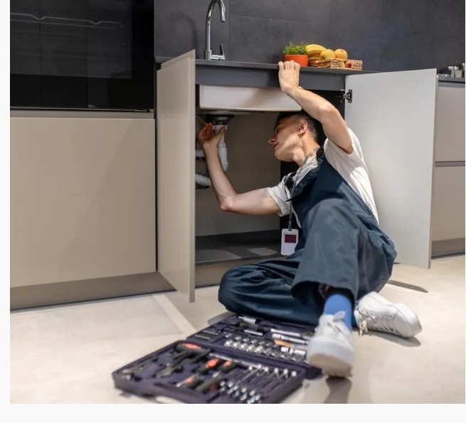 Kitchen fitter installing a modern unit